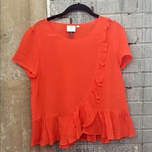 Bright Anthropologie blouse.